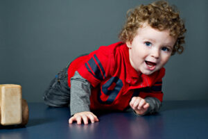 Family portrait of a toddler crawling by Nick Perry Photography