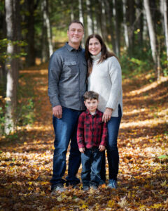 Father, mother and young boy posing in forest by Nick Perry Photography
