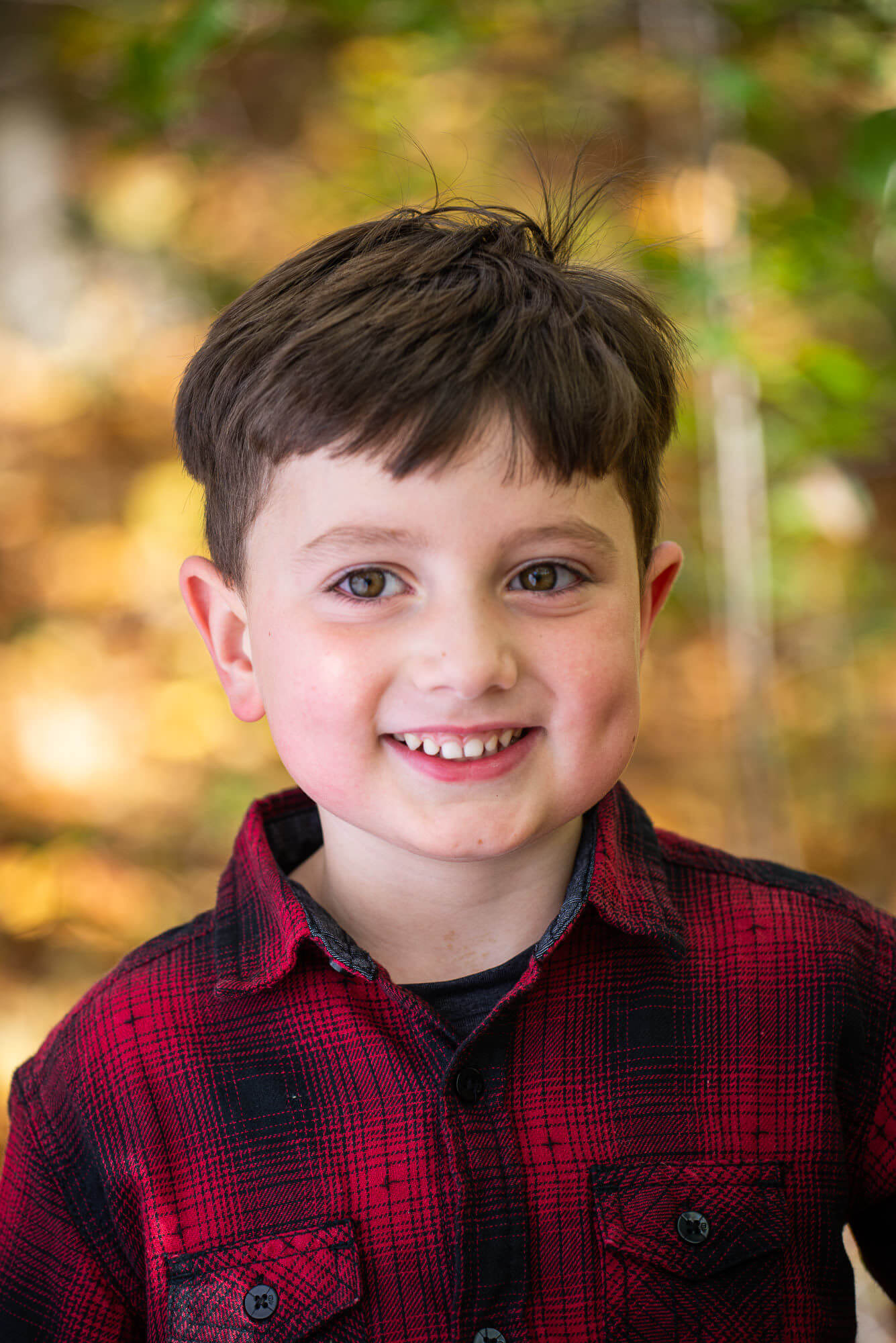 Portrait of a young boy smiling by Nick Perry Photography