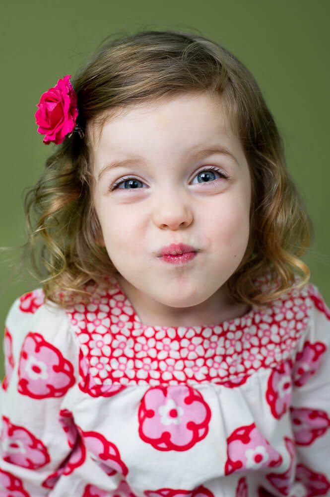 Cute girl making a funny face by Nick Perry Photography
