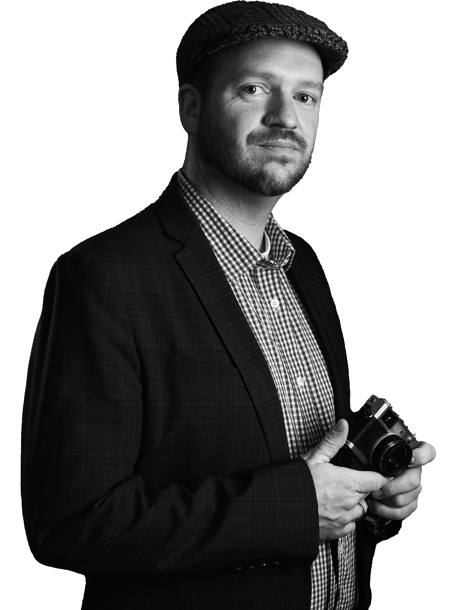 Portrait of professional photographer Nick Perry holding a vintage camera