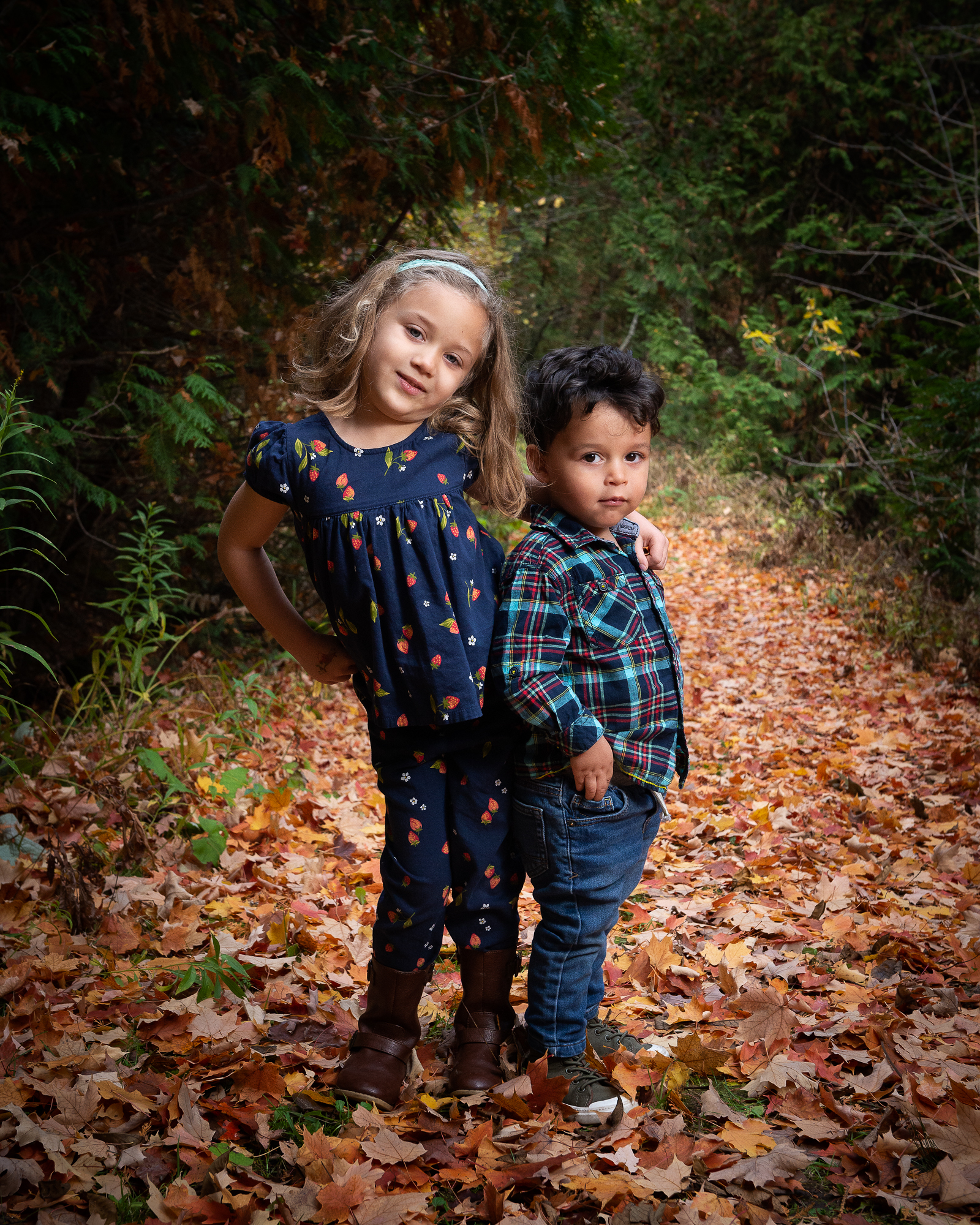 Two children standing on a trail